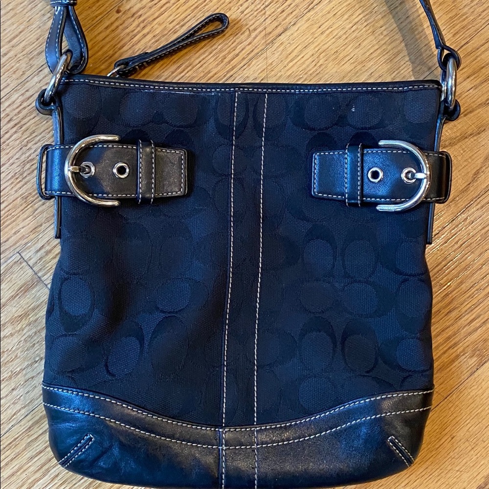 Coach black signature shoulder bag.